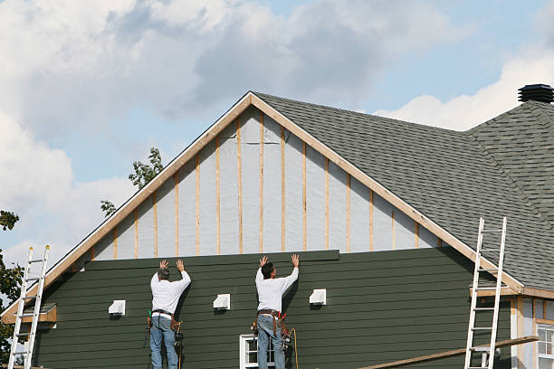 Professional Siding technician working in Cary, NC
